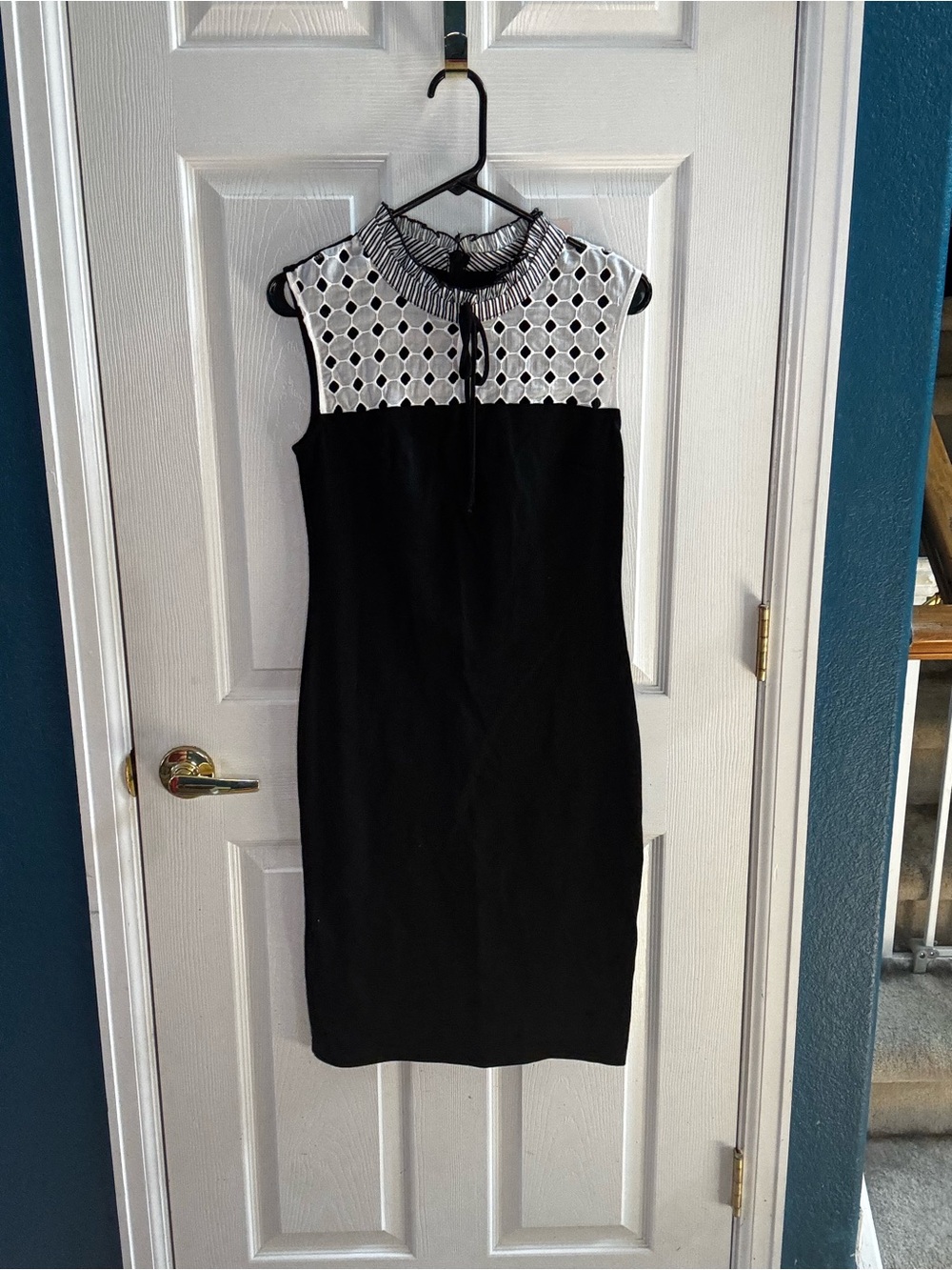 Sleeveless Black Dress with White Lace Yoke and Tied Neck